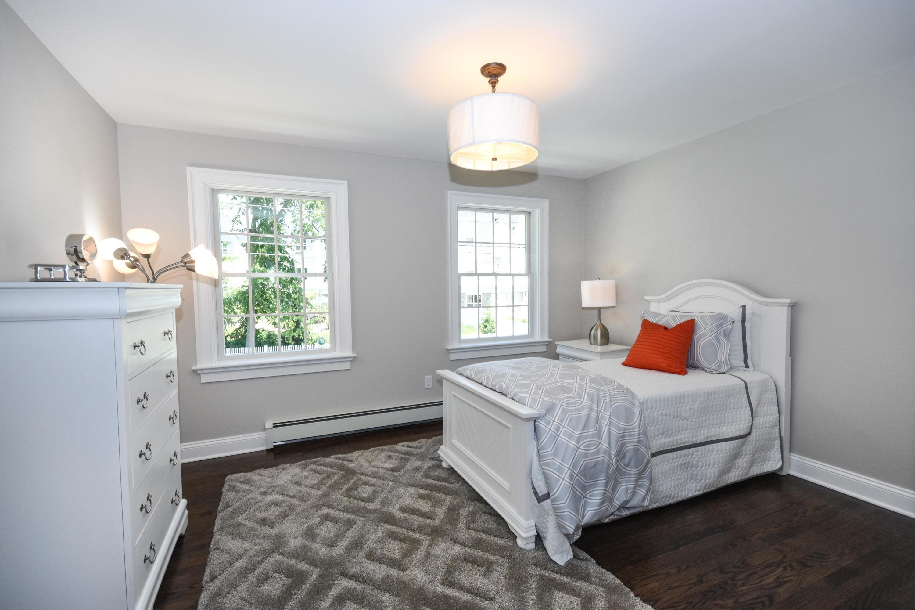 29 Brookside Road Darien, CT 06820 - Photo 16 of 26 a bedroom with a bed and window