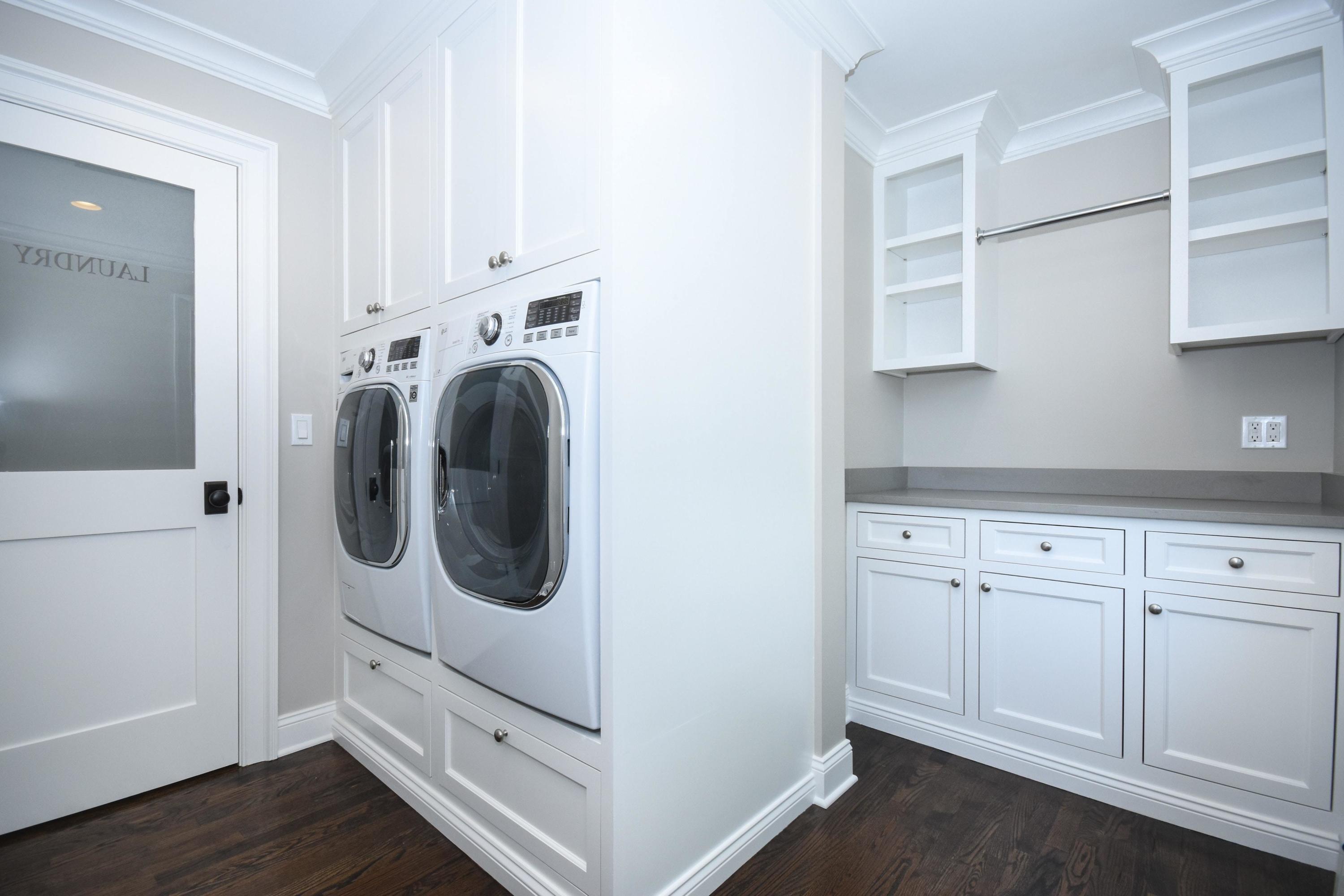 29 Brookside Road Darien, CT 06820 - Photo 19 of 26 a utility room with cabinets