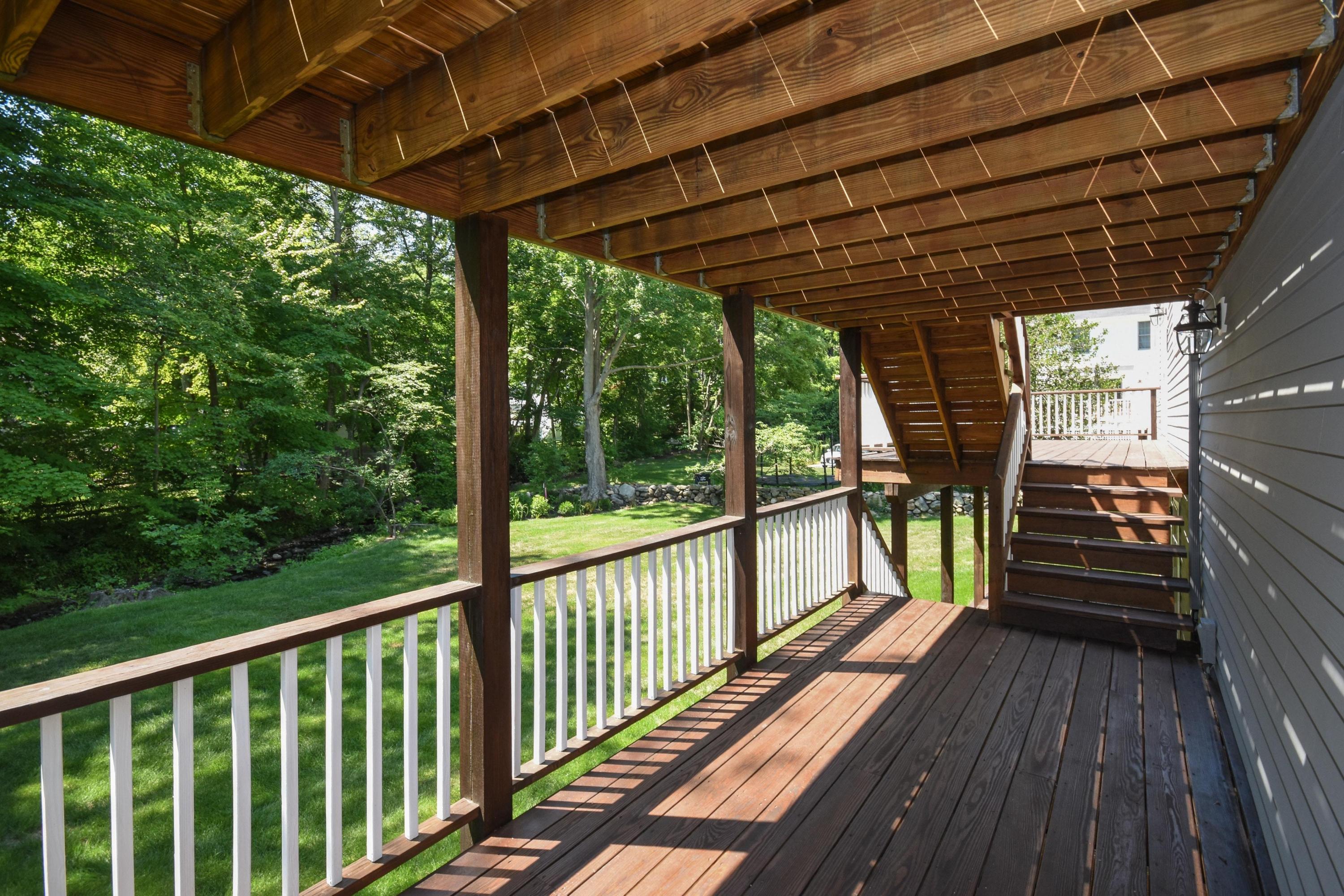 29 Brookside Road Darien, CT 06820 - Photo 22 of 26 a view of a room with wooden floor and outdoor space