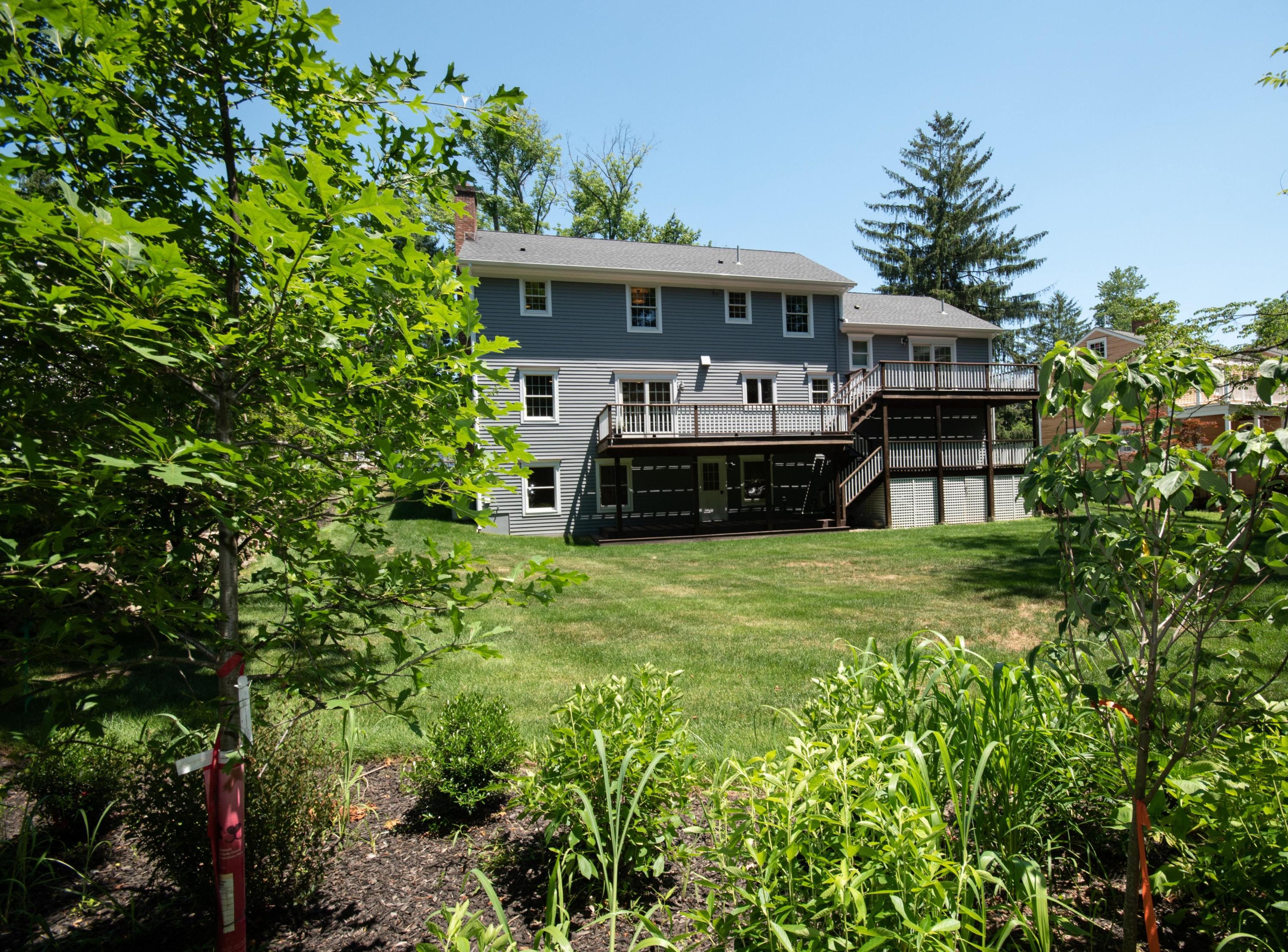 29 Brookside Road Darien, CT 06820 - Photo 24 of 26 a front view of a house with a garden