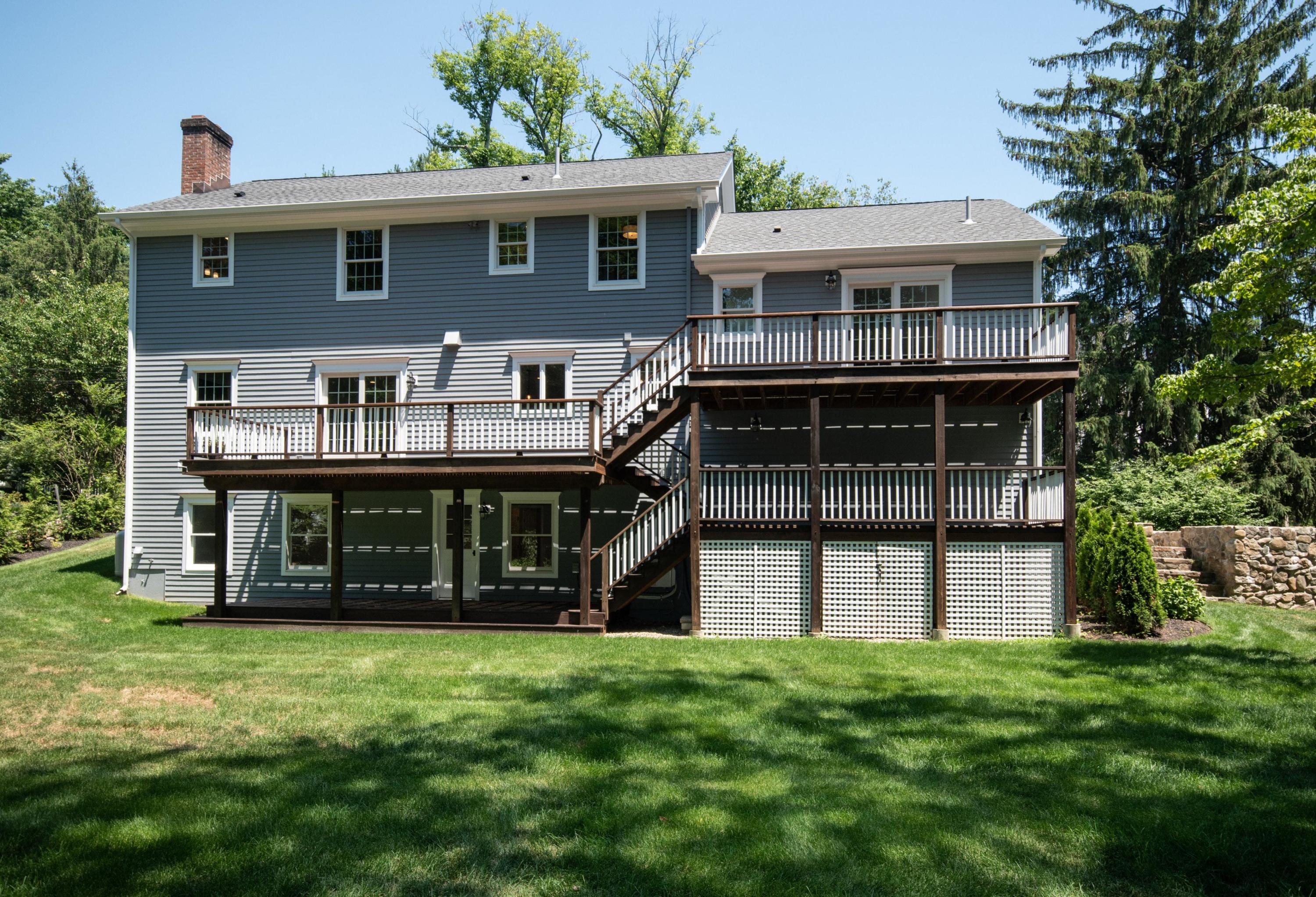 29 Brookside Road Darien, CT 06820 - Photo 25 of 26 a view of a house with a garden and deck