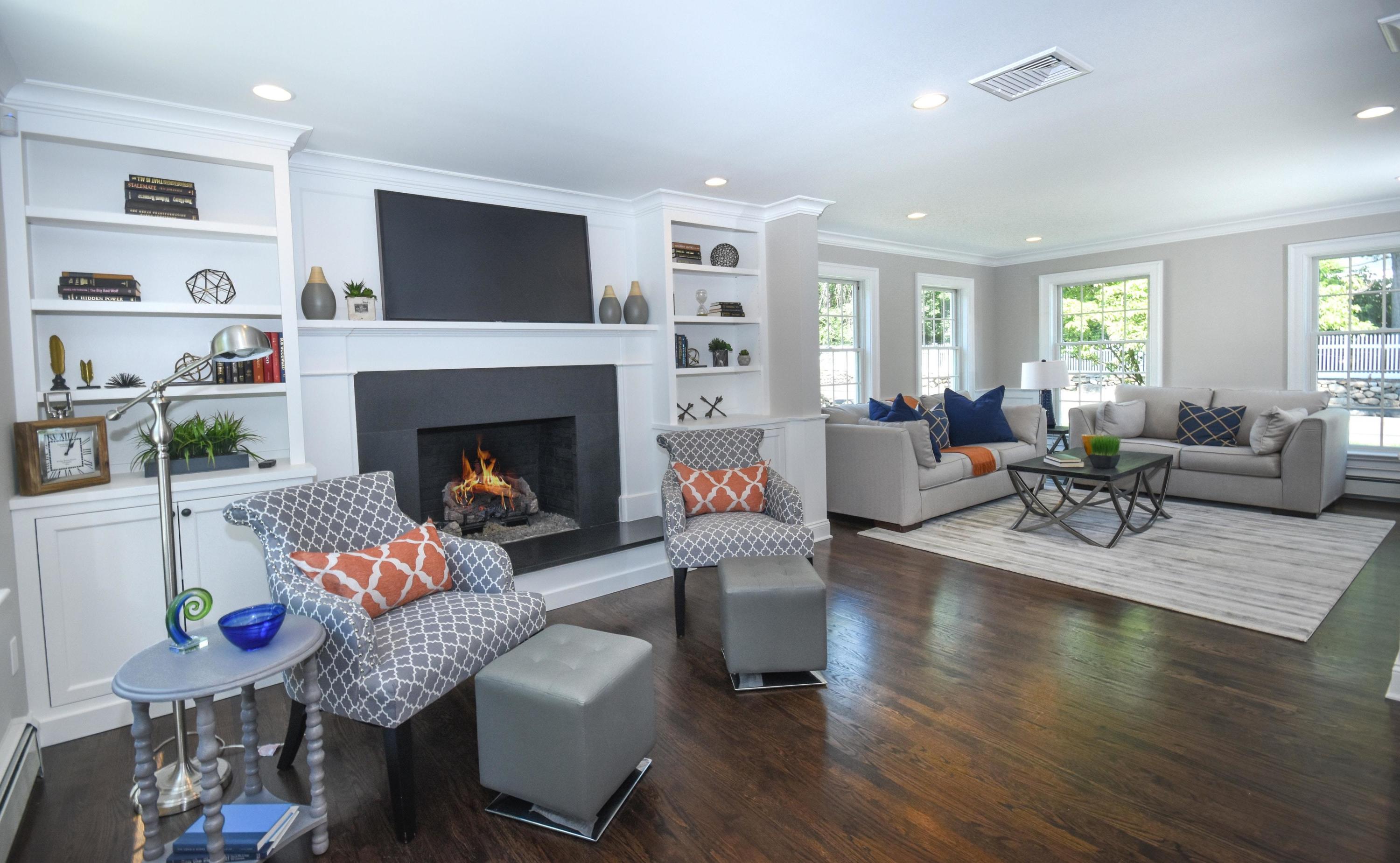 29 Brookside Road Darien, CT 06820 - Photo 7 of 26 a living room with furniture and a fireplace
