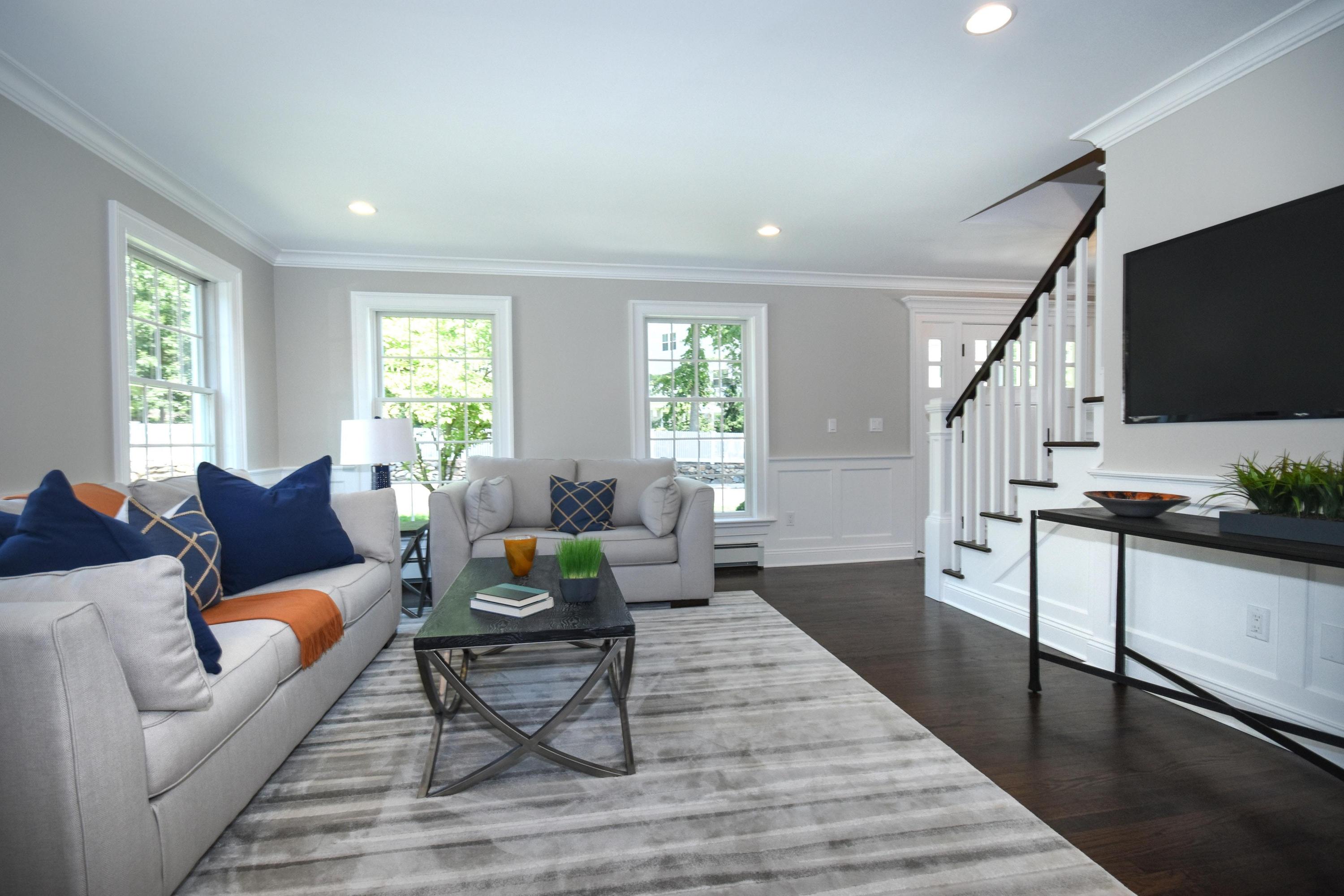 29 Brookside Road Darien, CT 06820 - Photo 8 of 26 a living room with furniture and a flat screen tv