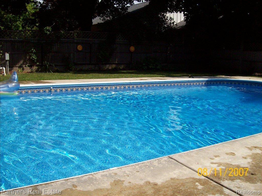 809 North Court Street Howell, MI 48843 - Photo 4 of 12 Summer Shot of Pool