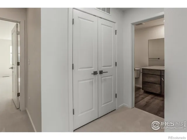 a bathroom with a sink a toilet a mirror and vanity