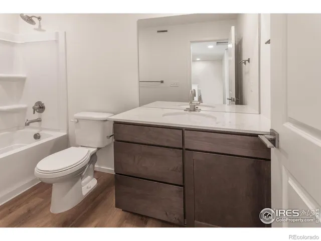 a bathroom with a toilet and a tub