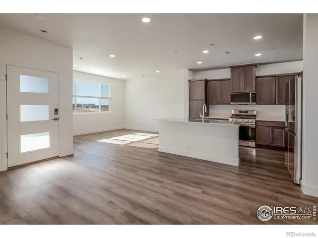 a view of kitchen with wooden floor