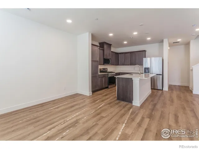 a view of kitchen with wooden floor