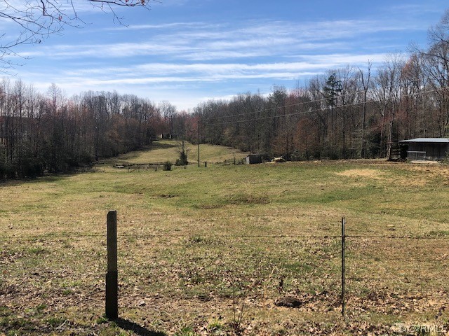 356 Wickham Road Bumpass, VA 23024 - Photo 4 of 15 a view of a yard with wooden fence