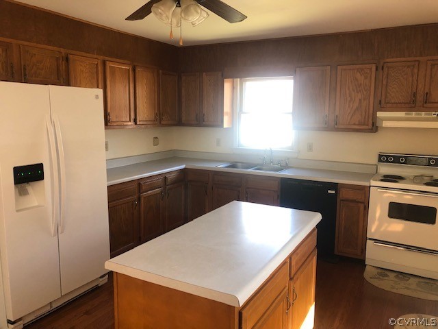 356 Wickham Road Bumpass, VA 23024 - Photo 6 of 15 a kitchen with a sink a refrigerator and cabinets