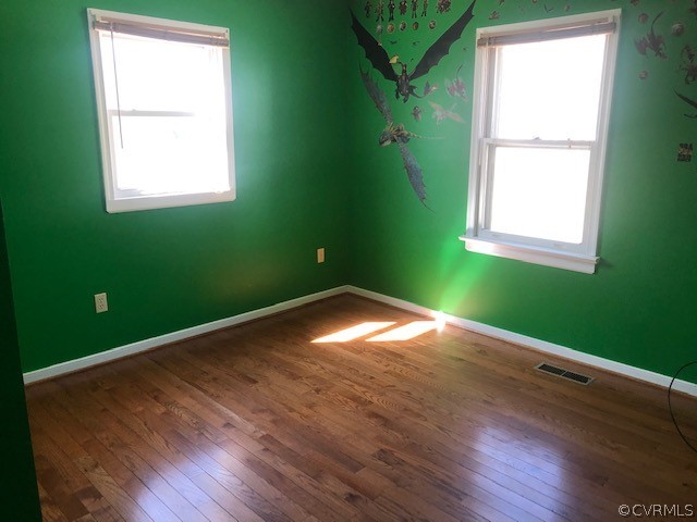 356 Wickham Road Bumpass, VA 23024 - Photo 9 of 15 an empty room with a window and a green space