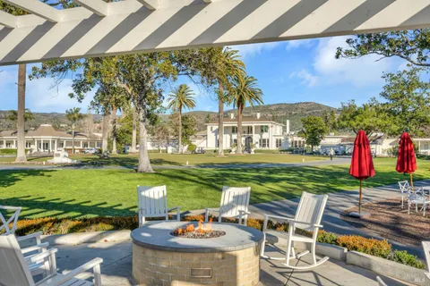 a view of a house with a swimming pool and a chair