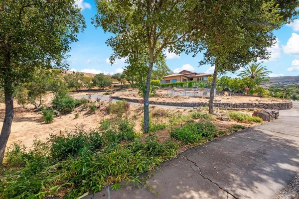 a view of a backyard of the house