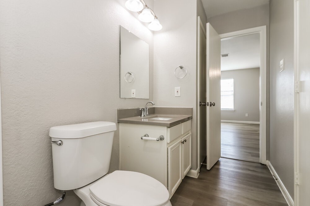 20622 Bishops Gate Lane Humble, TX 77338 - Photo 13 of 17 a bathroom with a toilet sink and mirror