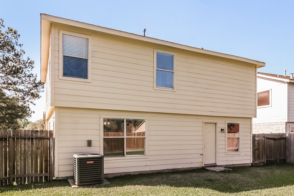 20622 Bishops Gate Lane Humble, TX 77338 - Photo 17 of 17 a front view of a house with a yard