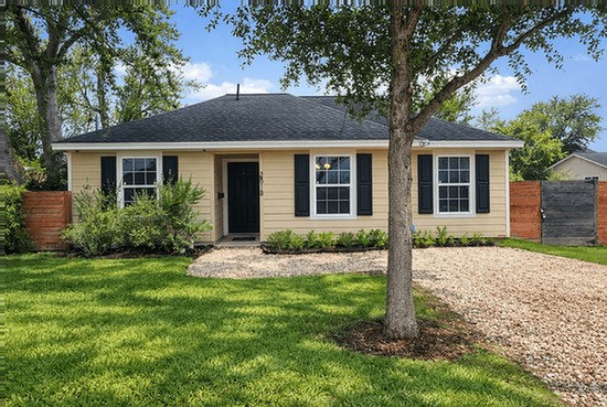 front view of a house with a yard