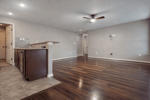 2518 Staples Street Houston, TX 77026 - Photo 4 of 22 an empty room with wooden floor and windows