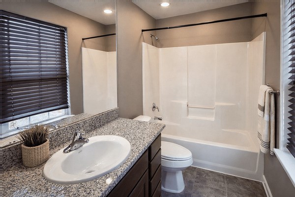 2518 Staples Street Houston, TX 77026 - Photo 8 of 22 a bathroom with a granite countertop sink toilet and shower