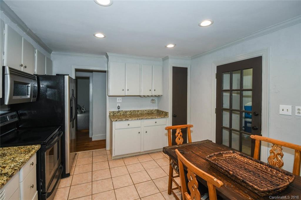 2408 Providence Road, Unit 6 Charlotte, NC 28211 - Photo 12 of 20 a kitchen with a refrigerator and a stove top oven