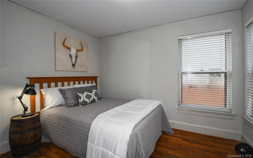 2408 Providence Road, Unit 6 Charlotte, NC 28211 - Photo 16 of 20 a bedroom with a bed and window
