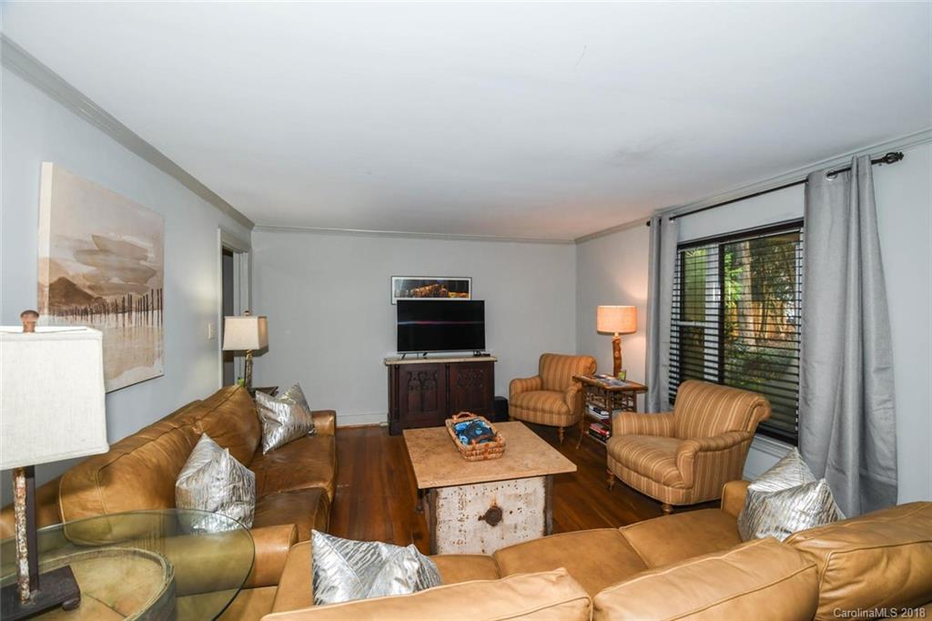 2408 Providence Road, Unit 6 Charlotte, NC 28211 - Photo 8 of 20 a living room with furniture and a flat screen tv
