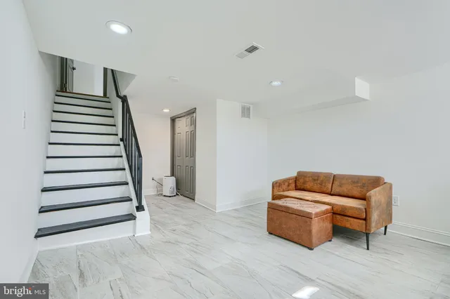 a room with furniture and stairs