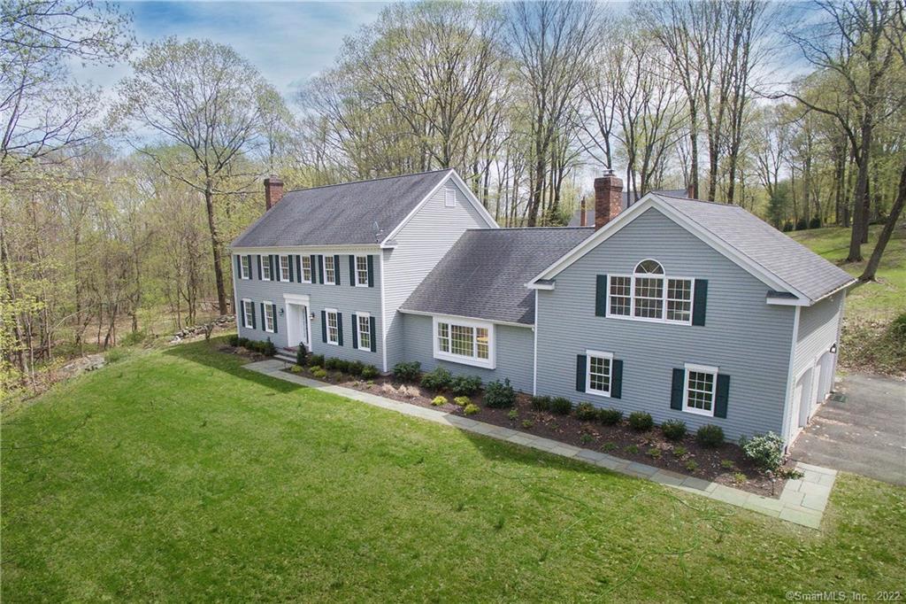 107 Barrack Hill Road Ridgefield, CT 06877 - Photo 1 of 1 a front view of a house with a yard