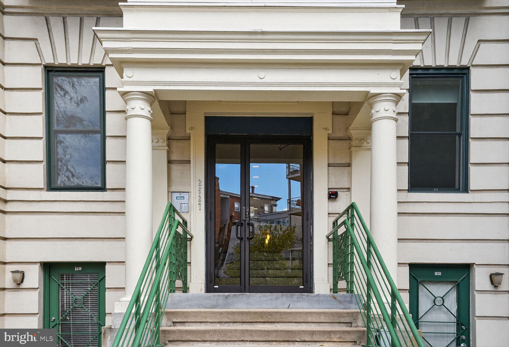 2627 Adams Mill Road Northwest, Unit 403 Washington, DC 20009 - Photo 2 of 38 a front view of a house with a potted plant
