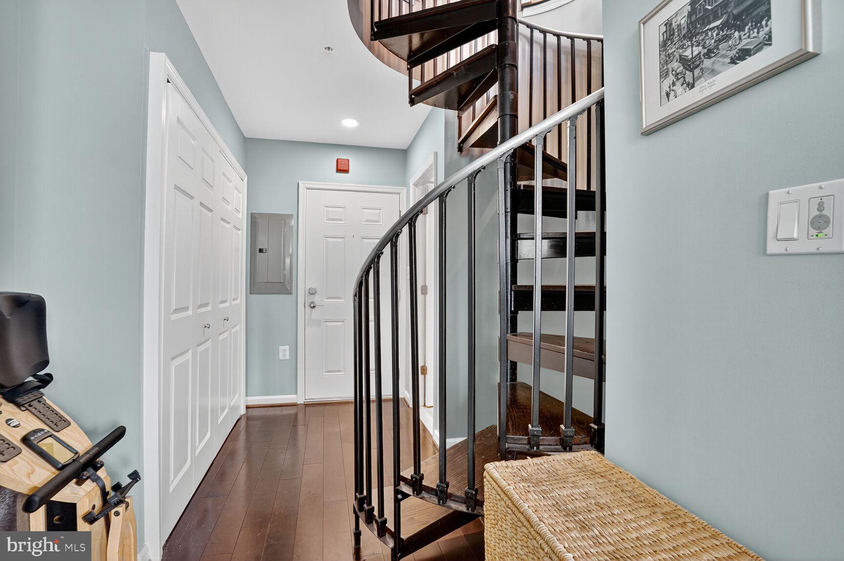 2627 Adams Mill Road Northwest, Unit 403 Washington, DC 20009 - Photo 22 of 38 a view of entryway with wooden floor and stairs