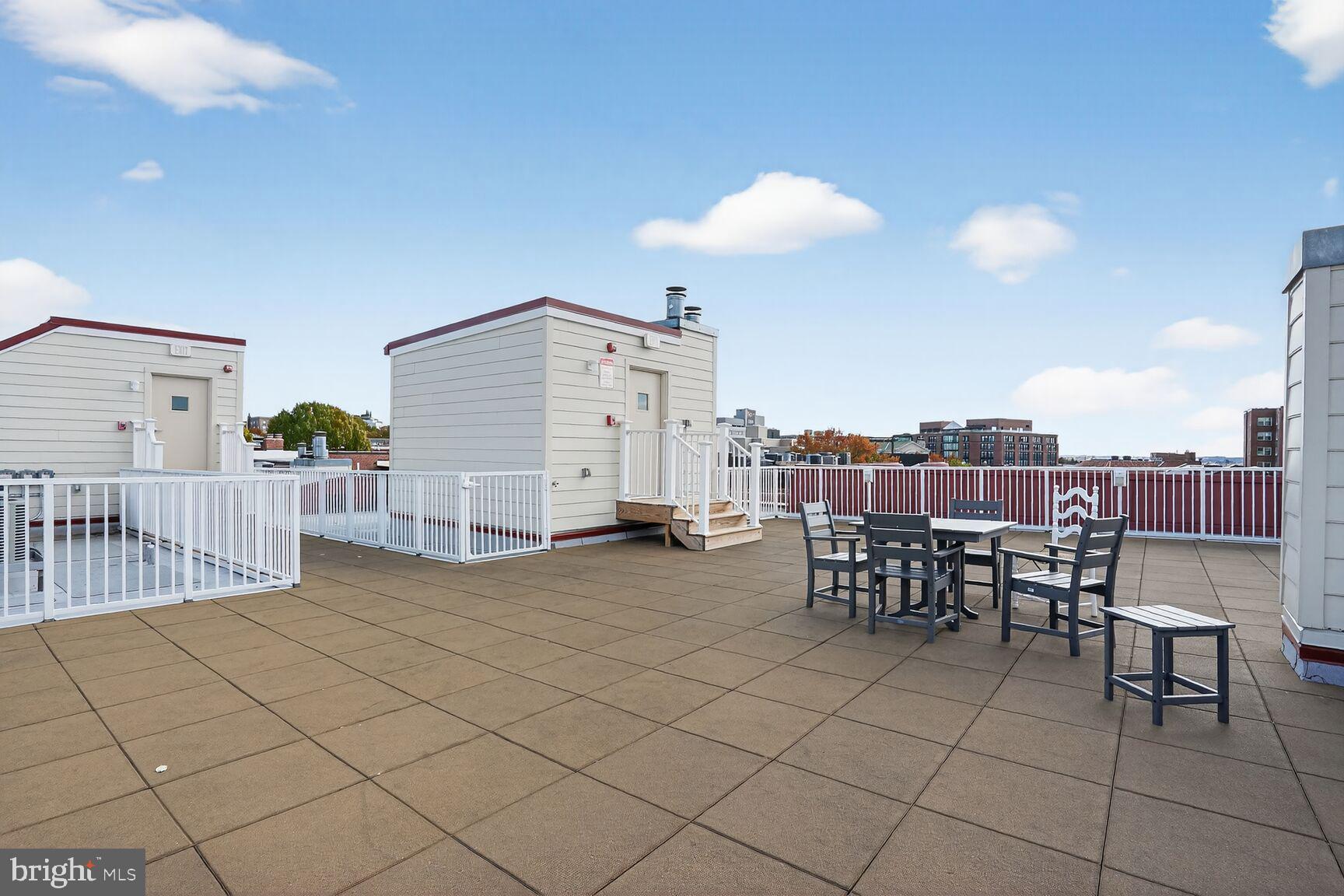 2627 Adams Mill Road Northwest, Unit 403 Washington, DC 20009 - Photo 30 of 38 a view of a terrace with furniture