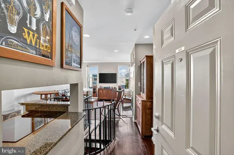 a view of a livingroom with furniture and a flat screen tv
