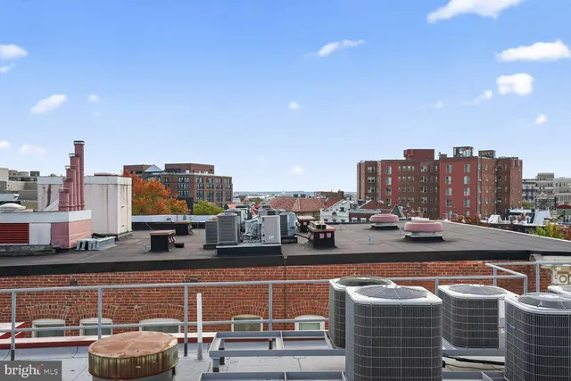 a view of hotel and seating in center