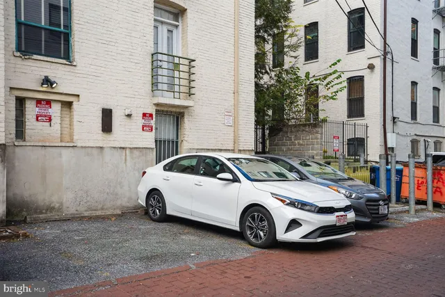 a city street lined with buildings and cars