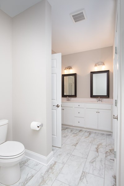 421 Alter Terrace Lebanon, TN 37087 - Photo 20 of 44 a bathroom with a toilet a sink and mirror