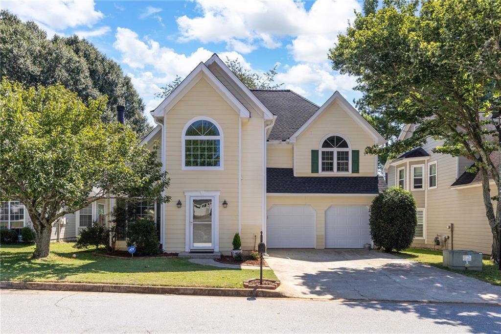 2829 Ashwood Place Decatur, GA 30030 - Photo 1 of 1 a front view of a house with a yard and garage