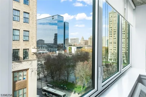 a view of a balcony with floor to ceiling windows