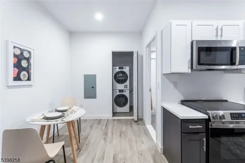 a kitchen with a table and chairs