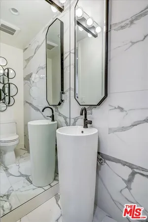 a bathroom with a sink and mirror