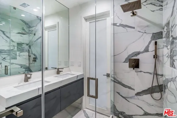 a bathroom with a sink and mirror