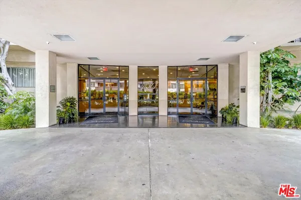 a view of a room with large windows