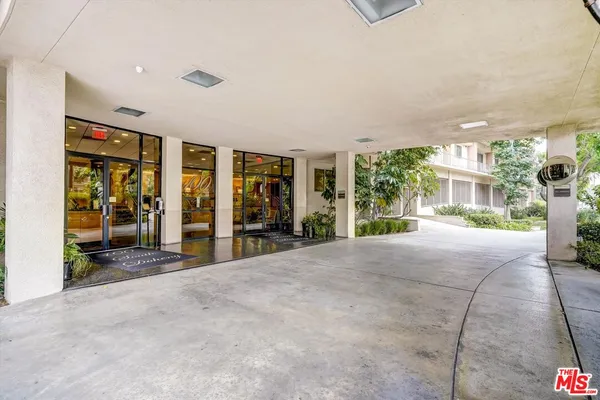 a view of a house with porch and furniture