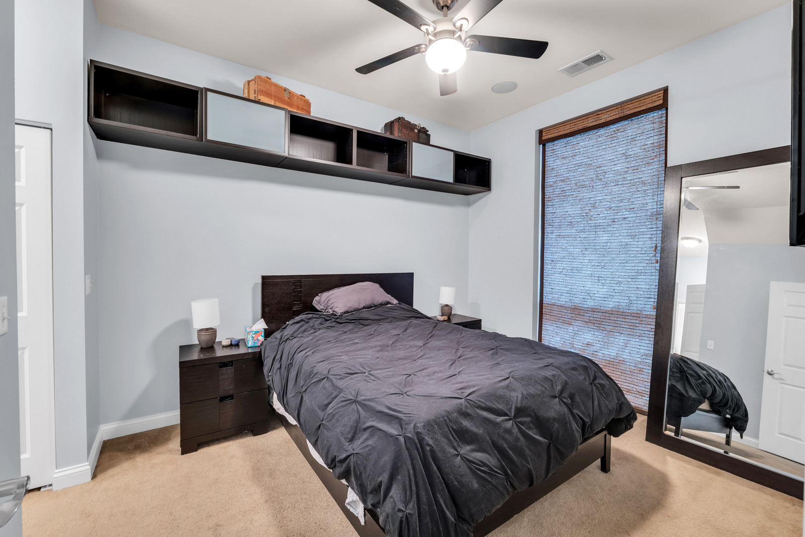 2025 South Indiana Avenue, Unit 209 Chicago, IL 60616 - Photo 5 of 10 a bedroom with a bed and a ceiling fan
