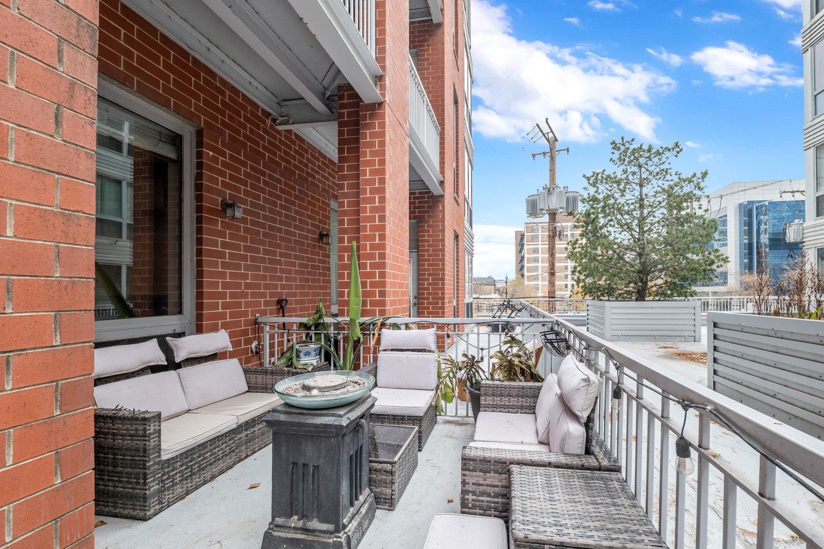 2025 South Indiana Avenue, Unit 209 Chicago, IL 60616 - Photo 10 of 10 a view of a patio with couches and potted plants