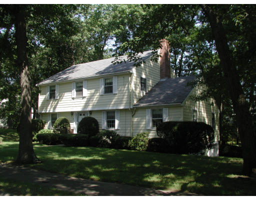 37 Ivy Road Wellesley, MA 02482 - Photo 1 of 1 a front view of a house with a garden