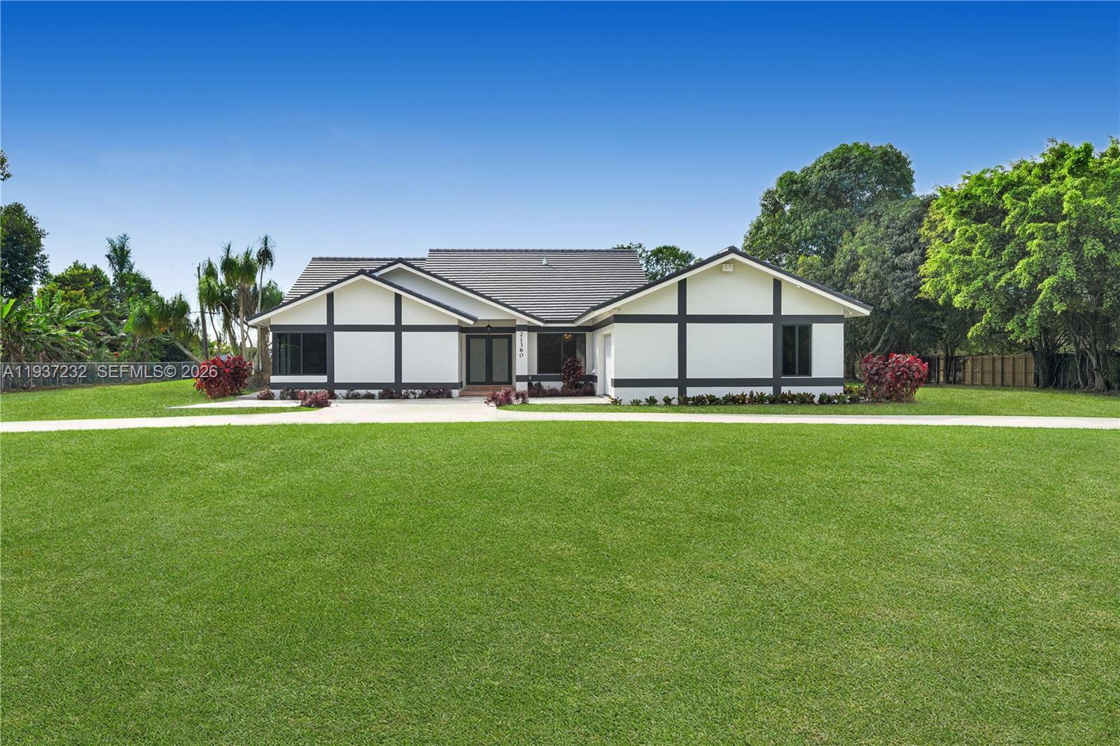 a view of a house with a big yard