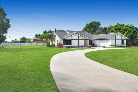 a view of a house with a big yard