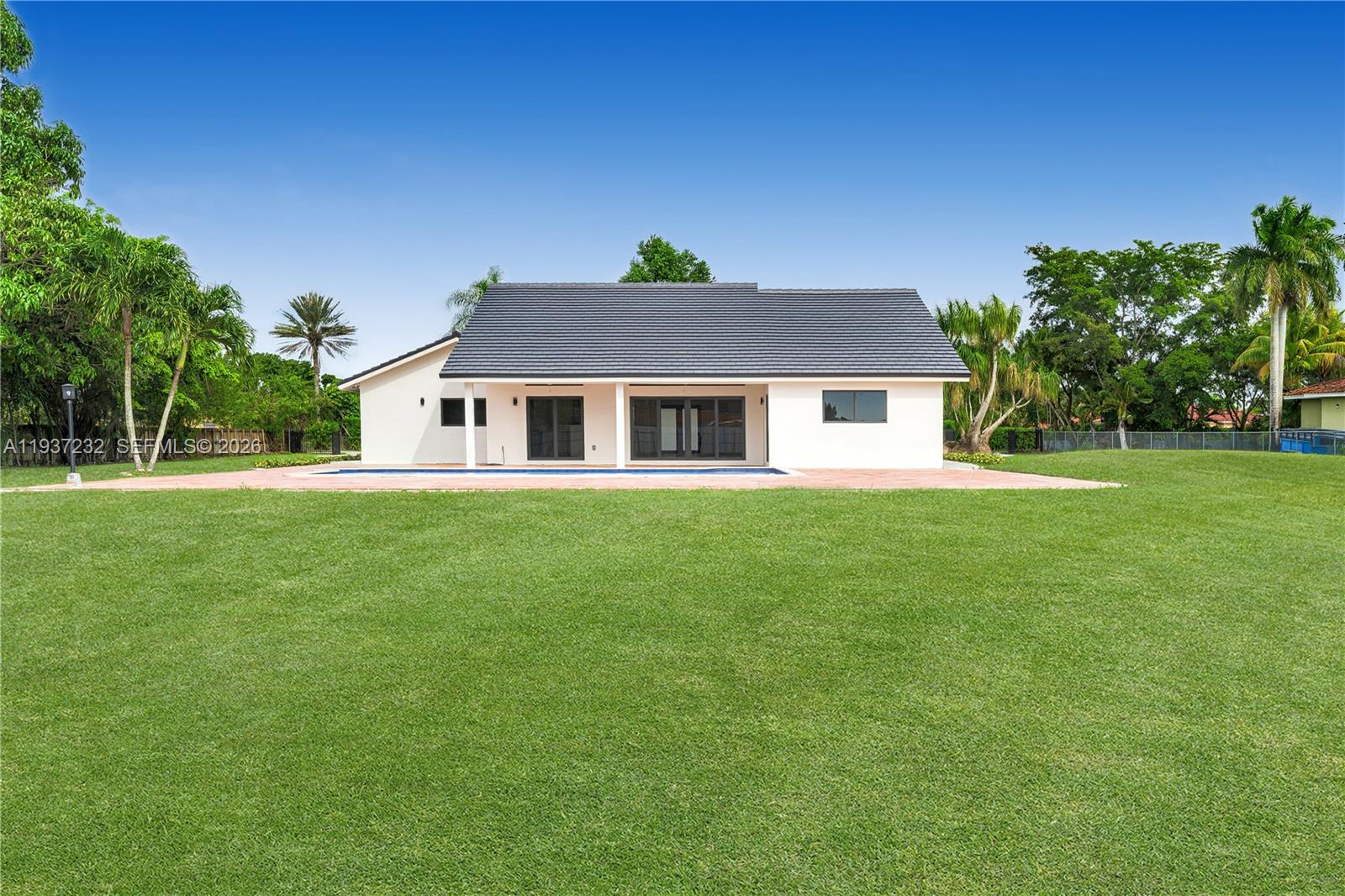 21360 Southwest 236th Street Homestead, FL 33031 - Photo 4 of 27 a front view of a house with a yard