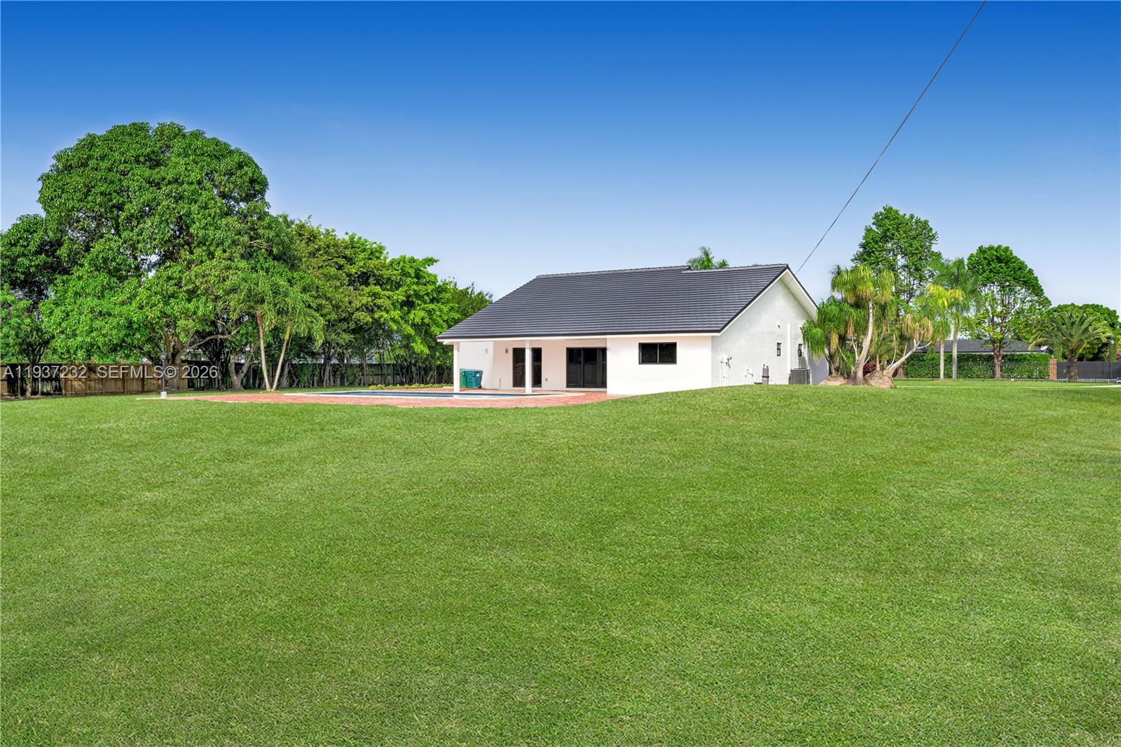 21360 Southwest 236th Street Homestead, FL 33031 - Photo 5 of 27 a front view of a house with a yard