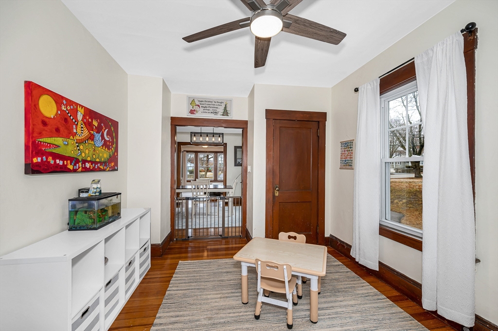567 Andover Street, Unit A Lowell, MA 01852 - Photo 11 of 35 a dining room with wooden floor and furniture