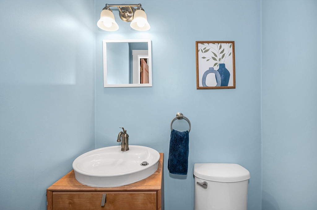 567 Andover Street, Unit A Lowell, MA 01852 - Photo 13 of 35 a bathroom with a toilet and a sink